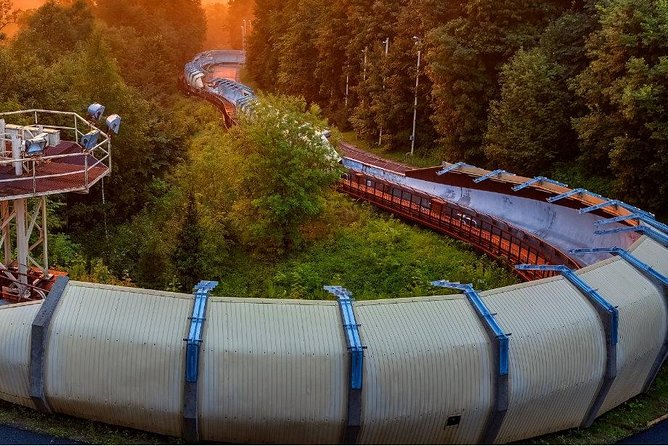 From Riga: Sigulda & Turaida Legends Group Tour - The bobsleigh track shows modern Sigulda