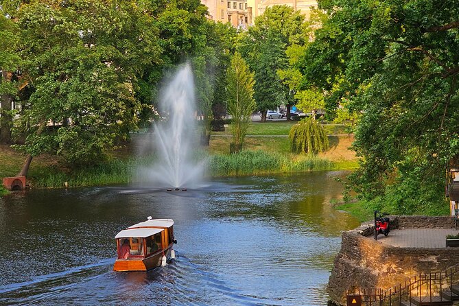 Riga Canal and Daugava Boat Tour with Welcome Drink & Audio Guide - What the audio guide and welcome drink add
