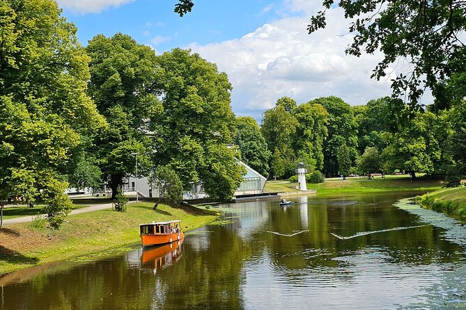 Riga Canal and Daugava Boat Tour with Welcome Drink & Audio Guide - The Freedom Monument from the canal