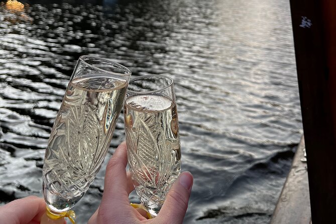 Riga: Evening or Sunset Boat Tour with Drink and Audio Guide - The audio guide is useful, but seat choice matters