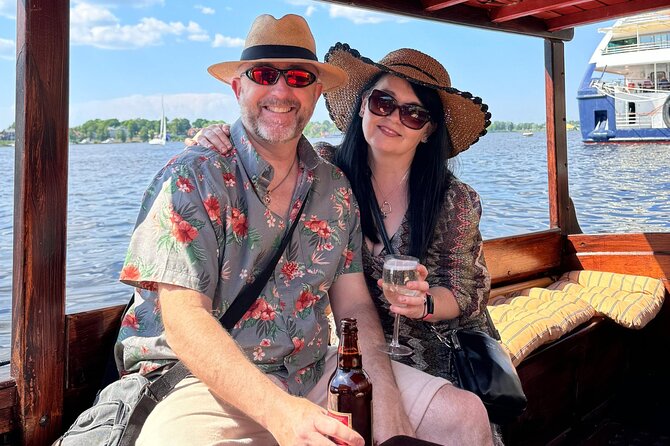 Riga: Evening or Sunset Boat Tour with Drink and Audio Guide - Sunset or night: choosing the right departure